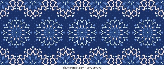 Seamless floral pattern. Stylized doodle flowers. Spanish ethnic embroidery. Folk ornament. Solar sign. Mediterranean print. Indian Oriental or Turkish textiles. Boho wallpaper. Hipster art.