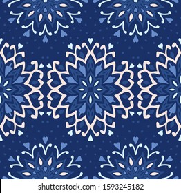 Seamless floral pattern. Stylized doodle flowers. Spanish ethnic embroidery. Folk ornament. Solar sign. Mediterranean print. Indian Oriental or Turkish textiles. Boho wallpaper. Hipster art.
