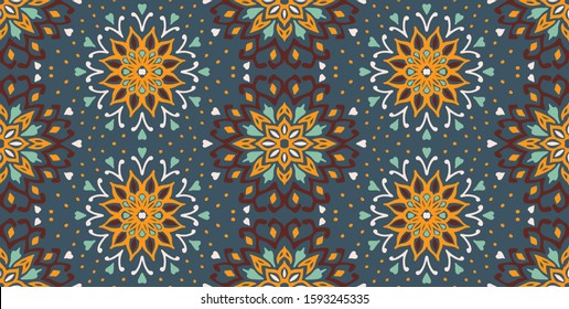 Seamless floral pattern. Stylized doodle flowers. Spanish ethnic embroidery. Folk ornament. Solar sign. Mediterranean print. Indian Oriental or Turkish textiles. Boho wallpaper. Hipster art.