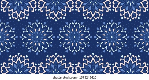 Seamless floral pattern. Stylized doodle flowers. Spanish ethnic embroidery. Folk ornament. Solar sign. Mediterranean print. Indian Oriental or Turkish textiles. Boho wallpaper. Hipster art.