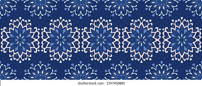Seamless floral pattern. Stylized doodle flowers. Spanish ethnic embroidery. Folk ornament. Solar sign. Mediterranean print. Indian Oriental or Turkish textiles. Boho wallpaper. Hipster art.