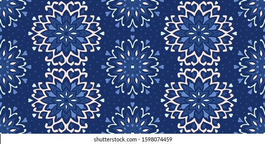 Seamless floral pattern. Stylized doodle flowers. Spanish ethnic embroidery. Folk ornament. Solar sign. Mediterranean print. Indian Oriental or Turkish textiles. Boho wallpaper. Hipster art.