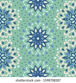 Seamless floral pattern. Stylized doodle flowers. Spanish ethnic embroidery. Folk ornament. Solar sign. Mediterranean print. Indian Oriental or Turkish textiles. Boho wallpaper. Hipster art.