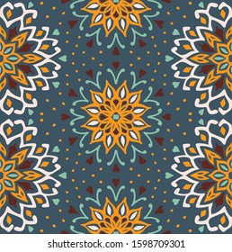 Seamless floral pattern. Stylized doodle flowers. Spanish ethnic embroidery. Folk ornament. Solar sign. Mediterranean print. Indian Oriental or Turkish textiles. Boho wallpaper. Hipster art.