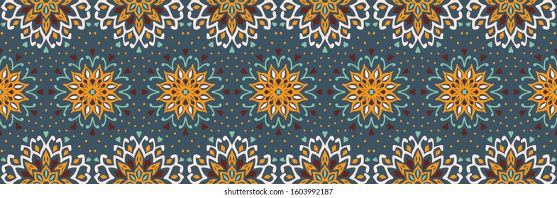 Seamless floral pattern. Stylized doodle flowers. Spanish ethnic embroidery. Folk ornament. Solar sign. Mediterranean print. Indian Oriental or Turkish textiles. Boho wallpaper. Hipster art.