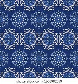 Seamless floral pattern. Stylized doodle flowers. Spanish ethnic embroidery. Folk ornament. Solar sign. Mediterranean print. Indian Oriental or Turkish textiles. Boho wallpaper. Hipster art.