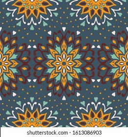 Seamless floral pattern. Stylized doodle flowers. Spanish ethnic embroidery. Folk ornament. Solar sign. Mediterranean print. Indian Oriental or Turkish textiles. Boho wallpaper. Hipster art.