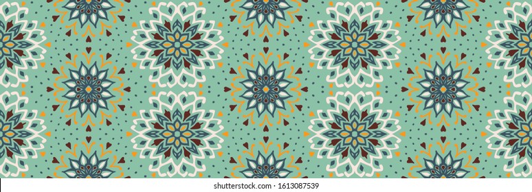 Seamless floral pattern. Stylized doodle flowers. Spanish ethnic embroidery. Folk ornament. Solar sign. Mediterranean print. Indian Oriental or Turkish textiles. Boho wallpaper. Hipster art.