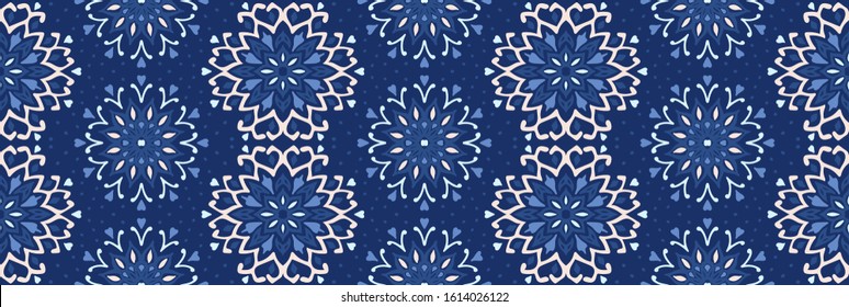 Seamless floral pattern. Stylized doodle flowers. Spanish ethnic embroidery. Folk ornament. Solar sign. Mediterranean print. Indian Oriental or Turkish textiles. Boho wallpaper. Hipster art.