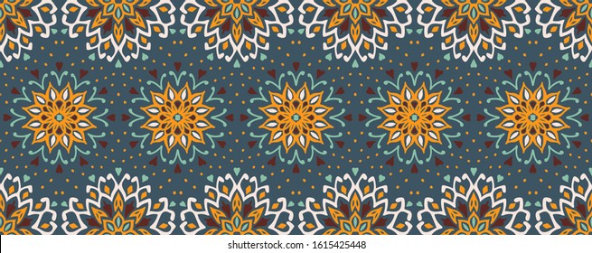 Seamless floral pattern. Stylized doodle flowers. Spanish ethnic embroidery. Folk ornament. Solar sign. Mediterranean print. Indian Oriental or Turkish textiles. Boho wallpaper. Hipster art.
