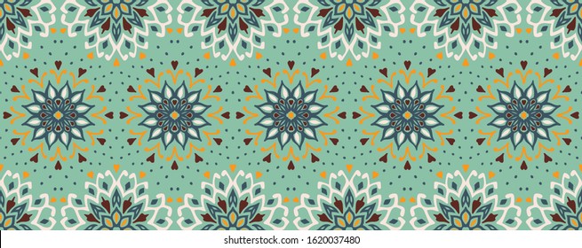 Seamless floral pattern. Stylized doodle flowers. Spanish ethnic embroidery. Folk ornament. Solar sign. Mediterranean print. Indian Oriental or Turkish textiles. Boho wallpaper. Hipster art.