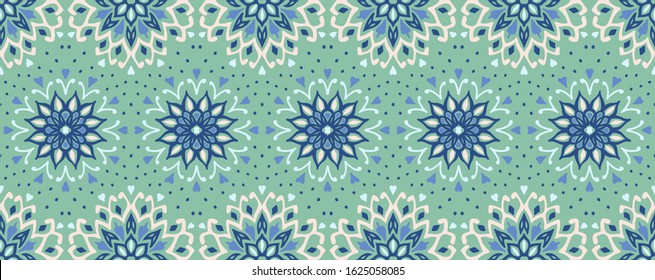 Seamless floral pattern. Stylized doodle flowers. Spanish ethnic embroidery. Folk ornament. Solar sign. Mediterranean print. Indian Oriental or Turkish textiles. Boho wallpaper. Hipster art.