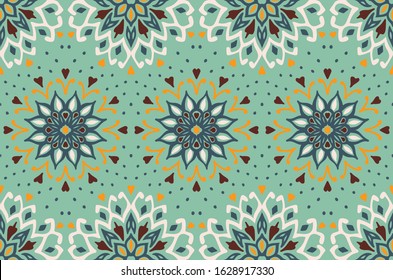 Seamless floral pattern. Stylized doodle flowers. Spanish ethnic embroidery. Folk ornament. Solar sign. Mediterranean print. Indian Oriental or Turkish textiles. Boho wallpaper. Hipster art.