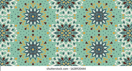Seamless floral pattern. Stylized doodle flowers. Spanish ethnic embroidery. Folk ornament. Solar sign. Mediterranean print. Indian Oriental or Turkish textiles. Boho wallpaper. Hipster art.