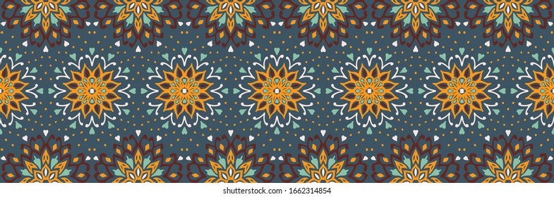 Seamless floral pattern. Stylized doodle flowers. Spanish ethnic embroidery. Folk ornament. Solar sign. Mediterranean print. Indian Oriental or Turkish textiles. Boho wallpaper. Hipster art.