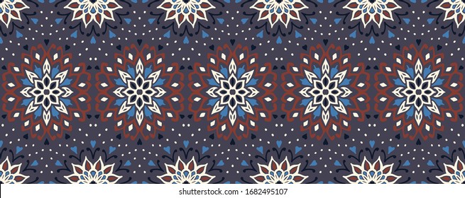 Seamless floral pattern. Stylized doodle flowers. Spanish ethnic embroidery. Folk ornament. Solar sign. Mediterranean print. Indian Oriental or Turkish textiles. Boho wallpaper. Hipster art.