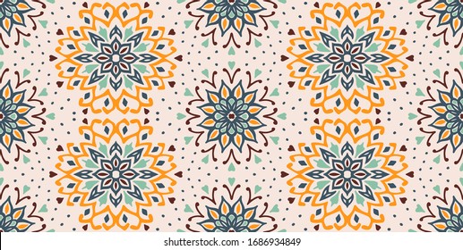 Seamless floral pattern. Stylized doodle flowers. Spanish ethnic embroidery. Folk ornament. Solar sign. Mediterranean print. Indian Oriental or Turkish textiles. Boho wallpaper. Hipster art.