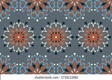 Seamless floral pattern. Stylized doodle flowers. Spanish ethnic embroidery. Folk ornament. Solar sign. Mediterranean print. Indian Oriental or Turkish textiles. Boho wallpaper. Hipster art.