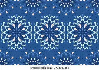 Seamless floral pattern. Stylized doodle flowers. Spanish ethnic embroidery. Folk ornament. Solar sign. Mediterranean print. Indian Oriental or Turkish textiles. Boho wallpaper. Hipster art.