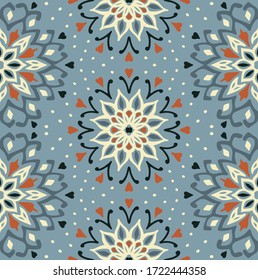 Seamless floral pattern. Stylized doodle flowers. Spanish ethnic embroidery. Folk ornament. Solar sign. Mediterranean print. Indian Oriental or Turkish textiles. Boho wallpaper. Hipster art.