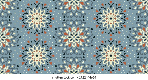 Seamless floral pattern. Stylized doodle flowers. Spanish ethnic embroidery. Folk ornament. Solar sign. Mediterranean print. Indian Oriental or Turkish textiles. Boho wallpaper. Hipster art.