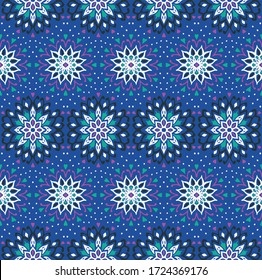 Seamless floral pattern. Stylized doodle flowers. Spanish ethnic embroidery. Folk ornament. Solar sign. Mediterranean print. Indian Oriental or Turkish textiles. Boho wallpaper. Hipster art.