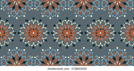 Seamless floral pattern. Stylized doodle flowers. Spanish ethnic embroidery. Folk ornament. Solar sign. Mediterranean print. Indian Oriental or Turkish textiles. Boho wallpaper. Hipster art.