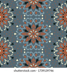 Seamless floral pattern. Stylized doodle flowers. Spanish ethnic embroidery. Folk ornament. Solar sign. Mediterranean print. Indian Oriental or Turkish textiles. Boho wallpaper. Hipster art.
