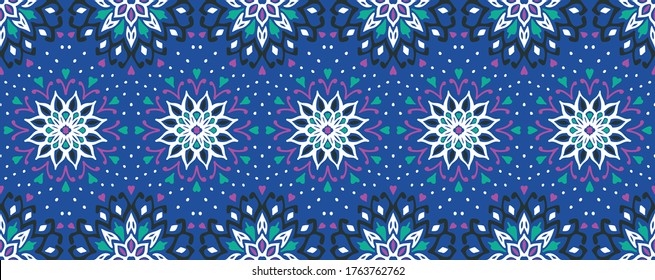 Seamless floral pattern. Stylized doodle flowers. Spanish ethnic embroidery. Folk ornament. Solar sign. Mediterranean print. Indian Oriental or Turkish textiles. Boho wallpaper. Hipster art.