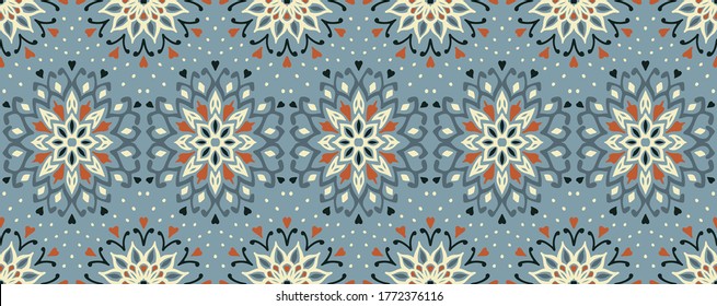 Seamless floral pattern. Stylized doodle flowers. Spanish ethnic embroidery. Folk ornament. Solar sign. Mediterranean print. Indian Oriental or Turkish textiles. Boho wallpaper. Hipster art.