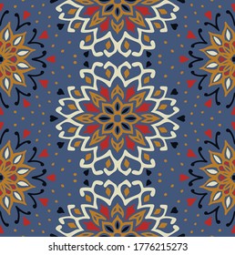 Seamless floral pattern. Stylized doodle flowers. Spanish ethnic embroidery. Folk ornament. Solar sign. Mediterranean print. Indian Oriental or Turkish textiles. Boho wallpaper. Hipster art.