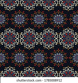 Seamless floral pattern. Stylized doodle flowers. Spanish ethnic embroidery. Folk ornament. Solar sign. Mediterranean print. Indian Oriental or Turkish textiles. Boho wallpaper. Hipster art.