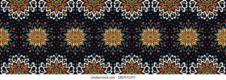 Seamless floral pattern. Stylized doodle flowers. Spanish ethnic embroidery. Folk ornament. Solar sign. Mediterranean print. Indian Oriental or Turkish textiles. Boho wallpaper. Hipster art.