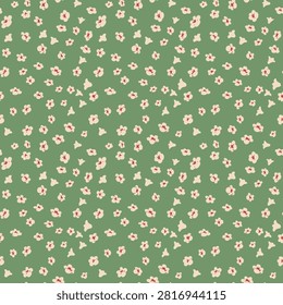 Seamless floral pattern with tiny cream blossoms and coral centers on a muted sage green background. Perfect for fabric, wallpaper, stationery, packaging and surface design