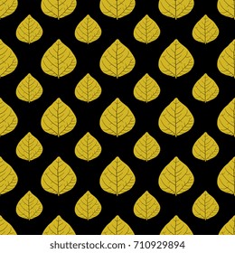 Seamless floral pattern with tree leaves. Yellow silhouettes on black background.