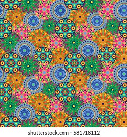 Seamless floral pattern with various motley multicolor geometric flowers, vector illustration as a childish clothes fabric
