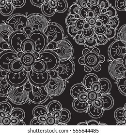 Seamless floral pattern with white decorative flowers on black background