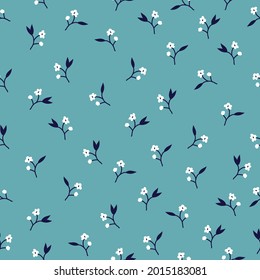 Seamless floral pattern of white flowers. Small flowers scattered on a light blue background. Stock vector for printing on surfaces and web design.