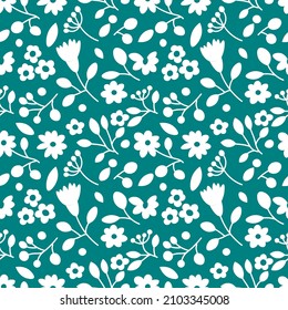 Seamless floral pattern in white and green colours. Repetitive background with different flowers, leaves and branches. Backdrop with plants drawn in a simple and modern style. Surface design.