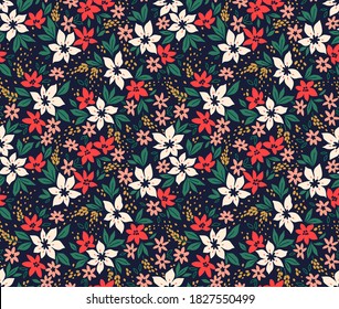 Seamless floral pattern with winter plants. Winter floral background. Colorful pattern with Christmas floral elements on a blue background. Holiday design for Christmas and New Year fashion prints.