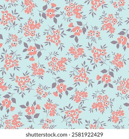 seamless floral vector orange small flowers with leaves pattern on blue background