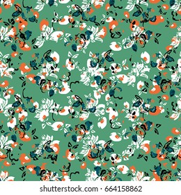 Seamless flower pattern with black, orange and white elements on green background 