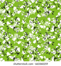 Seamless flower pattern with black and white elements on green background
