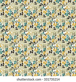 Seamless flower pattern with black, yellow and green elements on beige background