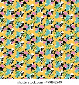 Seamless flower pattern with green, pink, black and white elements on yellow background