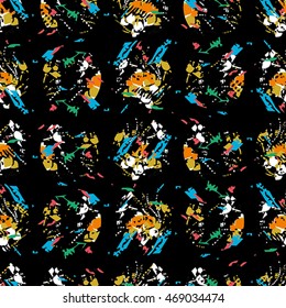 Seamless flower pattern with green, yellow, blue and white elements on black background