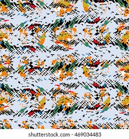 Seamless flower pattern with green, yellow, orange and black elements on blue background