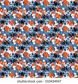 Seamless flower pattern with orange, black and white elements on blue background