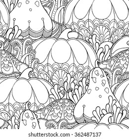 Seamless garden pattern in doodle style. Floral, ornate, decorative, tribal vector design elements. Black and white monochrome background. Pumpkins and leaves. Zentangle hand drawn coloring book page