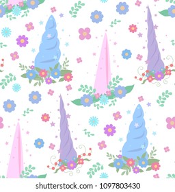 Seamless gentle pattern with unicorn horns, wreaths of flowers and stars on a white background. Vector texture for wallpaper, fabrics and your creative network
